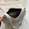 حقيبة كتف من المخمل المضلع بلون موحد مع إغلاق بسحاب، حقيبة هوبو من المخمل المضلع بتصميم بسيط، حقيبة تحت الإبط بتصميم عتيق بلون موحد للنساء، حقيبة يد عصرية بسيطة، حقيبة يد مربعة صغيرة، حقيبة باجيت تحت الإبط من المخمل المضلع بتصميم عتيق عصري، أسلوب الأموال 9