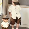 shein genkimix kids قميص كاجوال أحادي الصدر بأكمام قصيرة، لون سادة، للأولاد الصغار عمر 4 سنوات shein genkimix kids قميص كاجوال أحادي الصدر بأكمام قصيرة، لون سادة، للأولاد الصغار عمر 4 سنوات