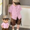 shein genkimix kids قميص كاجوال أحادي الصدر بأكمام قصيرة، لون سادة، للأولاد الصغار عمر 4 سنوات 8