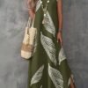shein lune فستان ماكسي كاجوال للنساء من قماش مُنسوج بتصميم أخضر عسكري بياقة على شكل حرف v بدون أكمام مع طبعة ريش عشوائية وشق في الفخذ shein lune فستان ماكسي كاجوال للنساء من قماش مُنسوج بتصميم أخضر عسكري بياقة على شكل حرف v بدون أكمام مع طبعة ريش عشوائية وشق في الفخذ