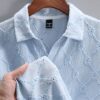 manfinity casualcool قميص بولو كاجوال للرجال ذو لون واحد بأزرار أمامية وأكمام قصيرة 5