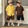 shein genkimix kids قميص كاجوال أحادي الصدر بأكمام قصيرة، لون سادة، للأولاد الصغار عمر 4 سنوات 10