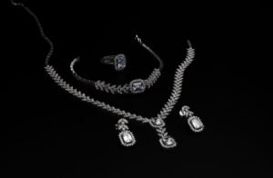pexels photo 19820885 19820885 1 Elegant diamond jewelry set including necklace, bracelet, ring, and earrings on a black backdrop.
